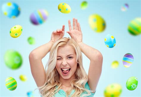 Happy Woman Making Bunny Ears Over Easter Eggs Stock Photo Image Of