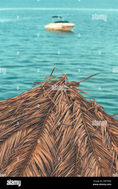 Dry Palm Leaf Beach Parasol For Sun Protection At Seaside During Summer