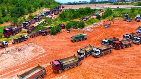 Huge Land Reclamation Process Truck Management Unloading Rock Dirt