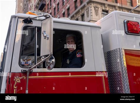 New York New York November 11 Member Of The Fdny Drives Truck