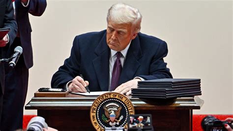 Donald Trump Uses Giant Sharpie To Sign Executive Orders On Immigration