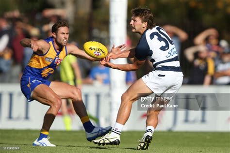 Tom Atkins Of The Cats Handballs During The 2019 Jlt Community Series