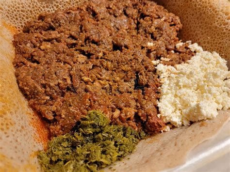 Raw Beef Ethiopian Food Called Kitfo with Bread and Greens and Cheese ...