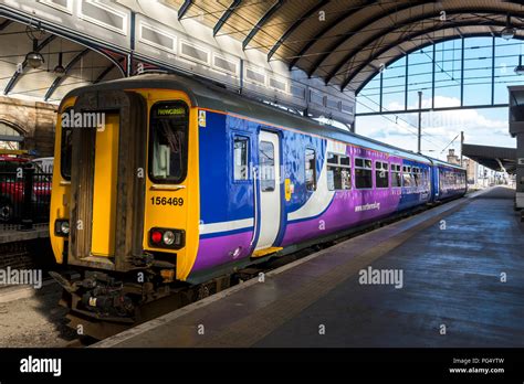 Northern Rail Class 156 Sprinter Passenger Train Waiting At A Station In Yorkshire England