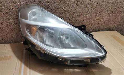 Reflektor przód przedni RENAULT Clio III lift 09 12 89903409 za 150 zł