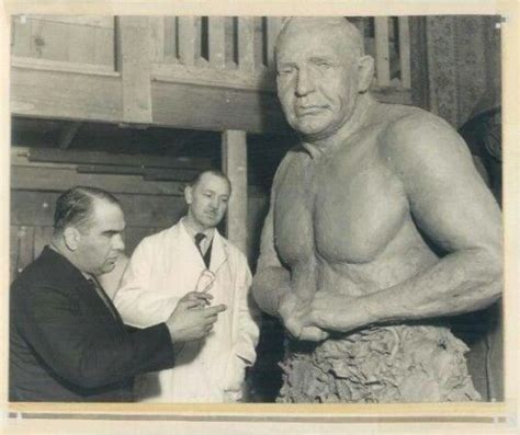 Ed Strangler Lewis Examines A Sculpture Being Constructed In His