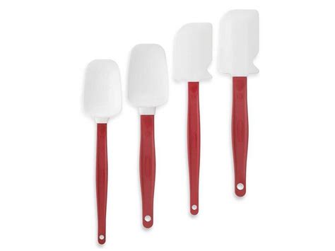 Three Spatulas With Red Handles Are Lined Up Next To Each Other