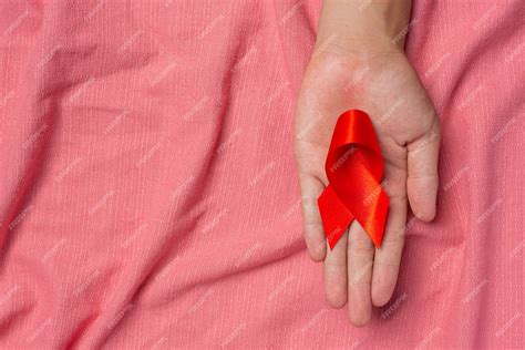 Free Photo Woman Hand Holding Red Ribbon Hiv Awareness Concept World