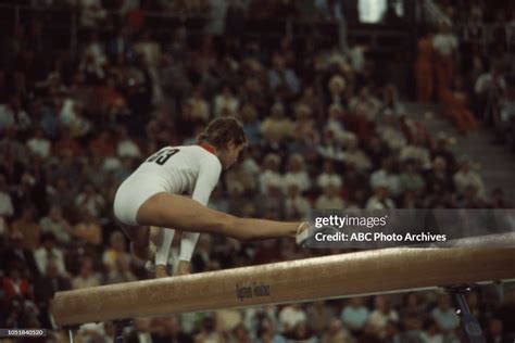 Olga Korbut competing in the Women's balance beam event at the 1972 ...