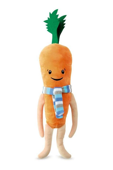 A Stuffed Carrot With A Scarf Around It S Neck And Eyes Standing Upright