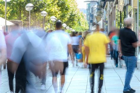 Blurred Crowd Of People Walking On City Sidewalk Stock Photo Image Of