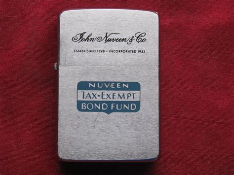 Zippo Lighter 1960 Advertising Nuveen Tax-Exempt Bond Fund – Mike's H&E Clocks