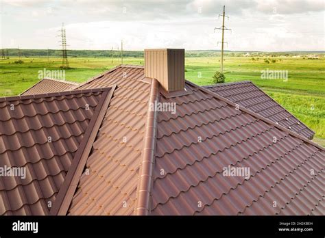 Aerial View Of House Roof Structure Covered With Brown Metal Tile