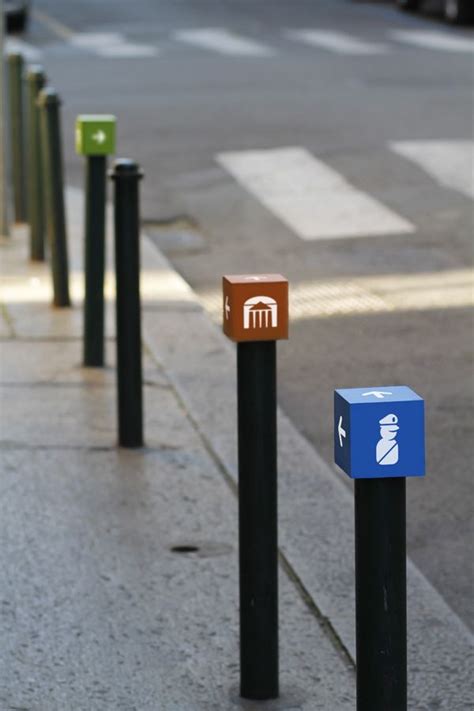 Three Different Colored Mailboxes On The Sidewalk