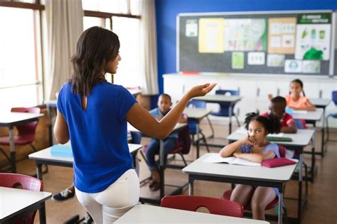 Premium Photo Rear View Of African American Female Teacher Teaching