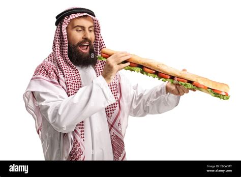 Saudi Arab Man Eating A Long Baguette Sandwich Isolated On White