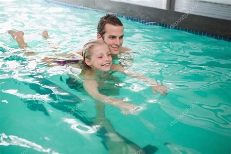 depositphotos_57250753-stock-photo-girl-learning-to-swim-with | Commercial Aquatic Services