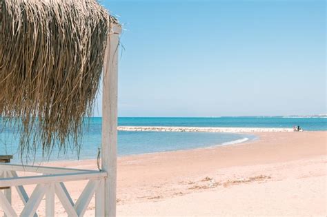 Premium Photo Massage Huts With Thatched Roof On Sand Beach Along