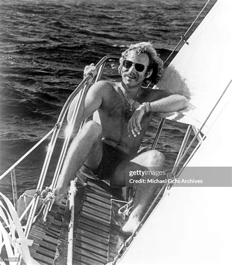 Singer Jimmy Buffett poses for a photo in his sailboat circa 1975 in ...