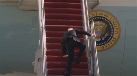 Biden Stumbles Multiple Times Falls As He Scales Air Force One Stairs