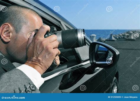 Detective Or Paparazzi Taking Photos From Inside A Car Stock Image