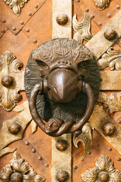 Medieval door knocker in eagle contour — Stock Photo © scigelova #55105275