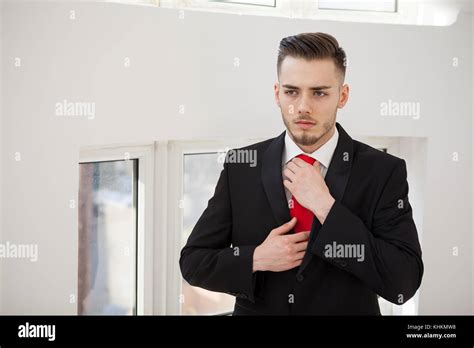 Business man in suit in office building interior Stock Photo - Alamy