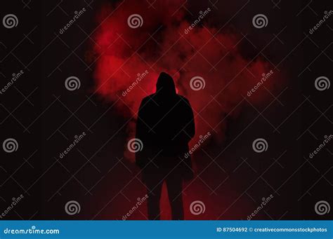 Silhouette Of Man Standing Against Black And Red Background Picture