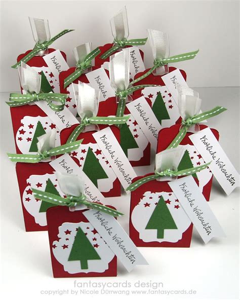 A Bunch Of Red And White Tags With Christmas Trees On Them