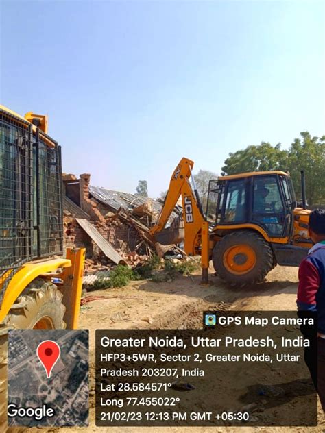 Free Photo Bulldozer Of Greater Noida Authority Runs In Patwari