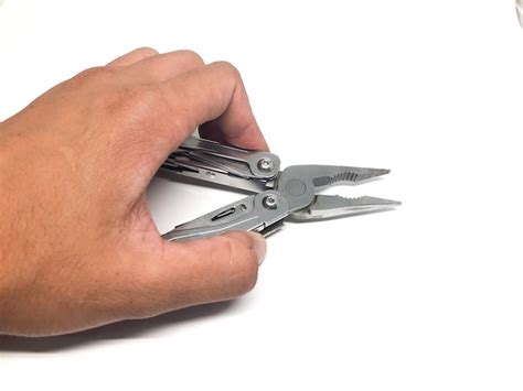 Premium Photo Cropped Image Of Hand Holding Work Tool Over White