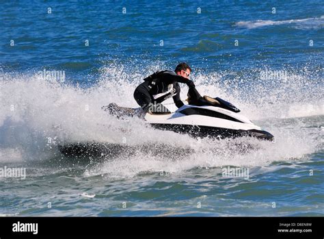 Man Riding A Jetski Dorset England Uk Stock Photo Alamy