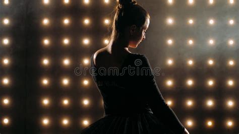 Silhouette of Ballerina in Black Dress is Dancing Ballet in the Dark Studio. Stock Footage ...