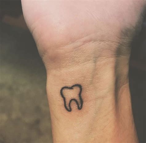 Simple Tooth Tattoo