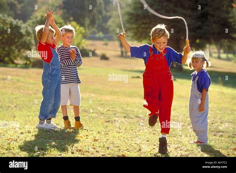 Portrait Of Kids In The Park Skipping Rope Stock Photo Alamy