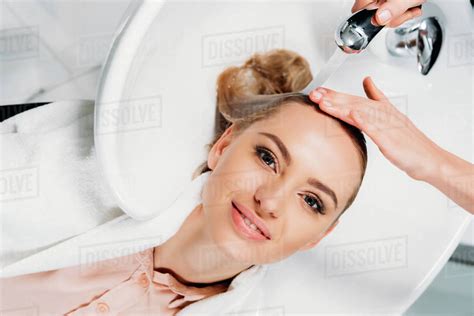 Top View Of Hairdresser Washing Hair For Customer At Salon Stock