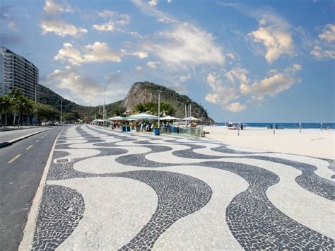 Premium Photo Famous Boardwalk On Copacabana Beach And Coconut Trees