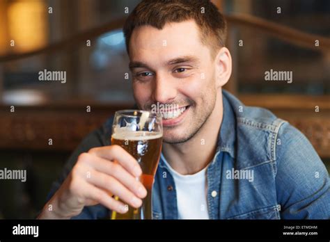 Happy Man Drinking Beer At Bar Or Pub Stock Photo Alamy