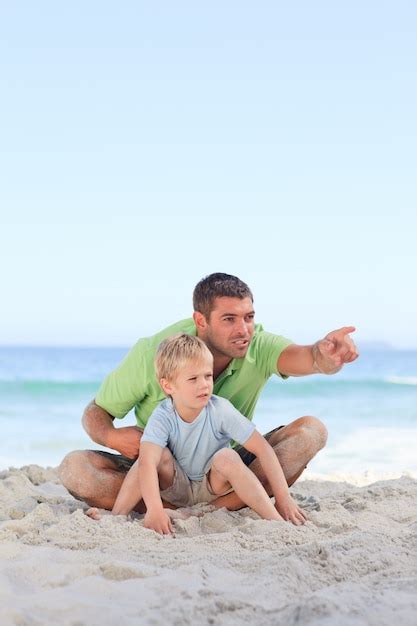 Premium Photo Happy Father With His Son At The Beach