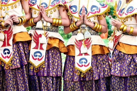 Indonesian National Costume Hands In Gold Bracelets Bright Colors