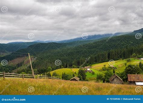 Rural Houses In Carpathian Mountains Cloudy Summer Landscape Ukraine