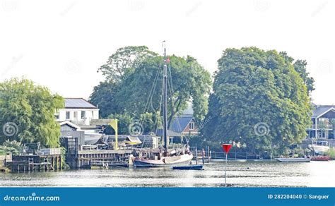 Boat at a Dock in Kinderdijk, Holland Stock Photo - Image of ...