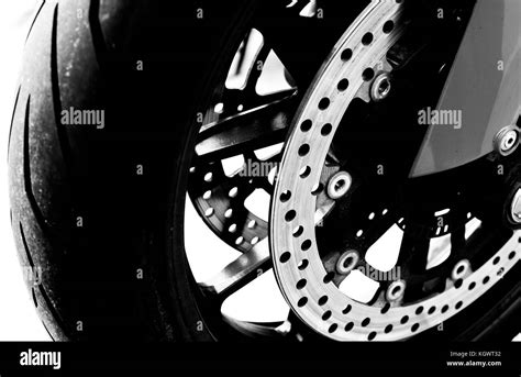 Isolated Motorcycle Front Wheel In Black And White Close Up View Of