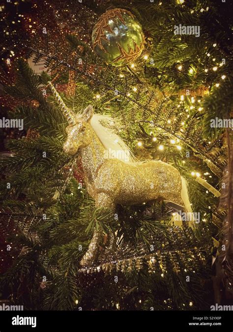 Christmas Unicorn Decoration On Tree Golden Colour Effect Stock Photo