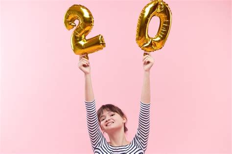 Premium Photo Woman Holding Inflatable Balloons In The Form Of Twenty