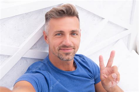 Premium Photo Photo Of Smiling Selfie Man With Phone At Home Selfie