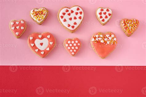 Decorated Heart Shape Cookies On A Colored Red And Pink Background Top