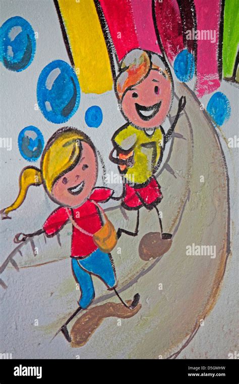 Happy kids, illustration on wall Stock Photo - Alamy