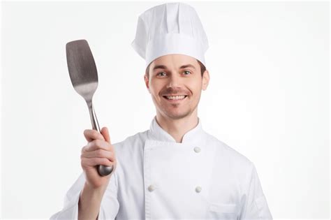 Premium Ai Image A Chef Holding A Spatula And Smiling