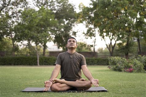 Man Doing Yoga Outdoors Stock Photo At Vecteezy